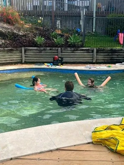 Outdoor lesson in progress with pool toys